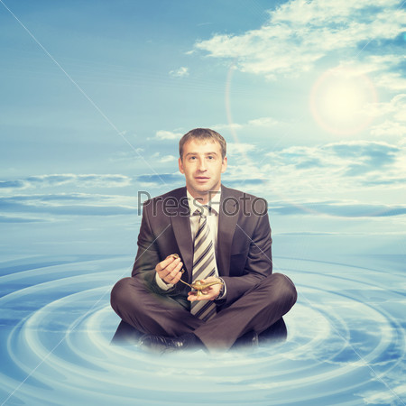 Businessman sitting on cloud with oil lamp