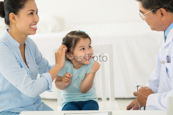 Girl and mother visiting doctor