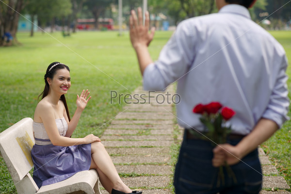 Young couple meeting in the park on Valentines Day