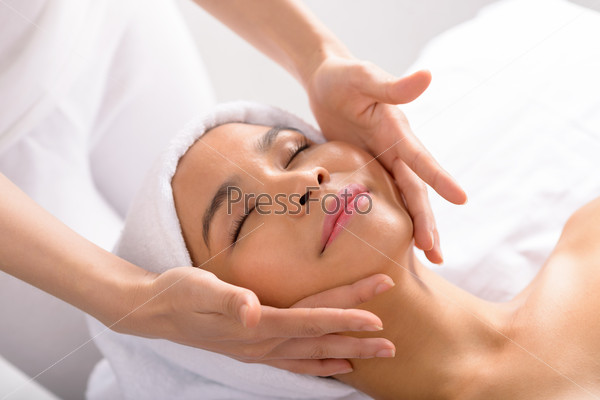 Woman enjoying face massage
