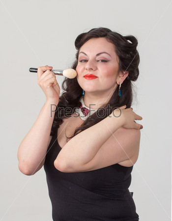Pretty brunette girl posing like Marilyn Monroe with red lips