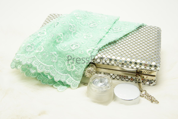 Evening bag with lace gloves and cosmetic.