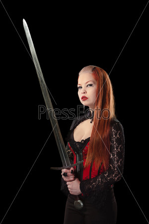 Portrait of gorgeous redhead woman with long sword