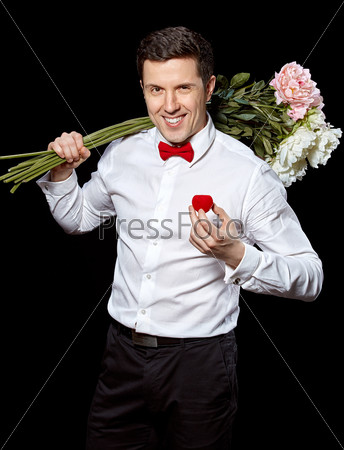 The elegant man with a ring and flowers