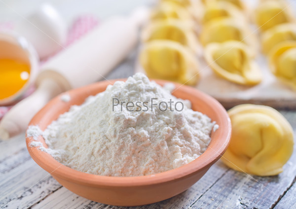flour and raw pelmeni