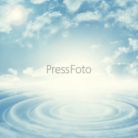 Natural blue sky background with bright spot in center, stock photo