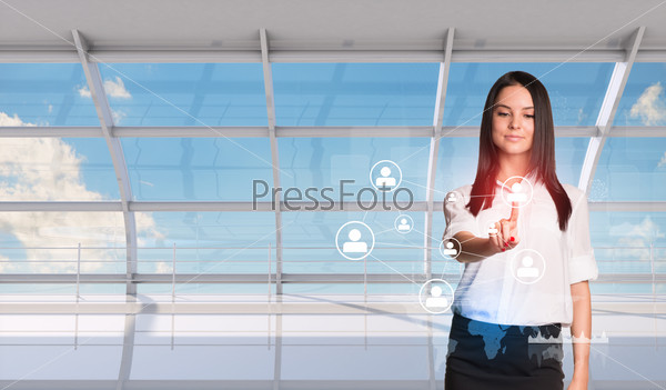 Young woman pressing on holographic screen