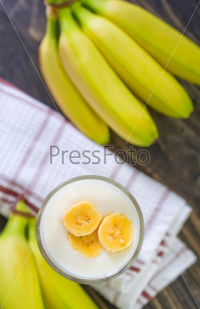 banana yogurt in bowl and on a table