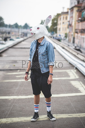 rabbit mask young handsome bearded hipster man in the city