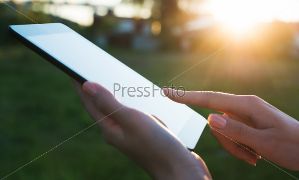 Close up of a womman using mobile tablet pc