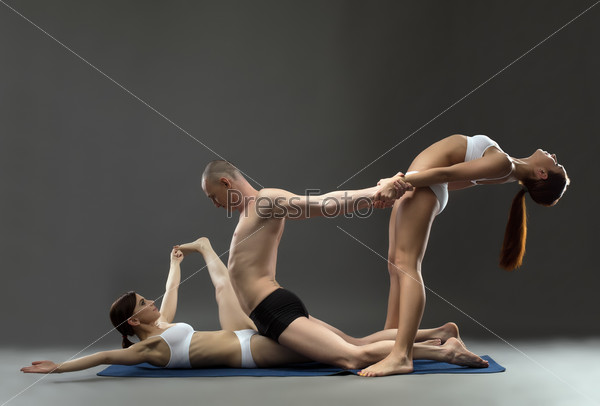 Yoga. Group of trainers posing in studio