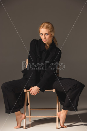 Beauty blond woman on chair
