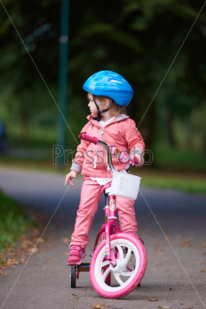 little girl with bicycle