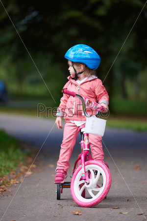 little girl with bicycle