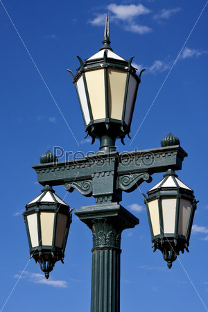 old green street lamp and clouds in  buenos aires argentina
