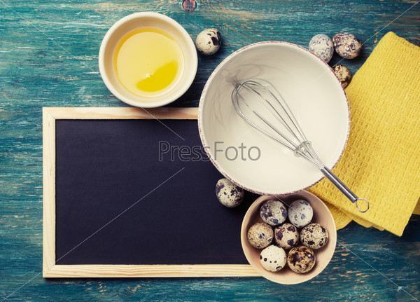 Cooking food - ingredients and black chalk board. Template for recipes or food menu