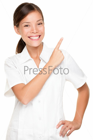 Beauty salon spa woman pointing isolated on white background. Portrait of beautiful young asian employee in uniform.