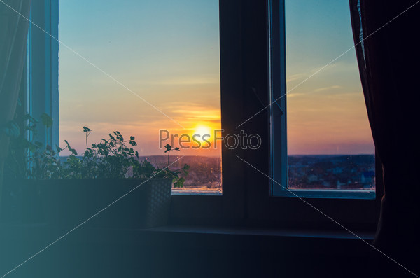 View on beautiful sunrise from home window, stock photo