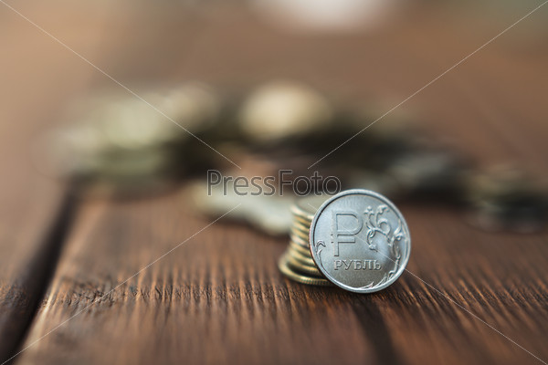 Top view coins on old wooden desk with copy space on top, stock photo