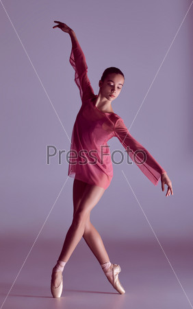 Young ballerina dancer showing her techniques