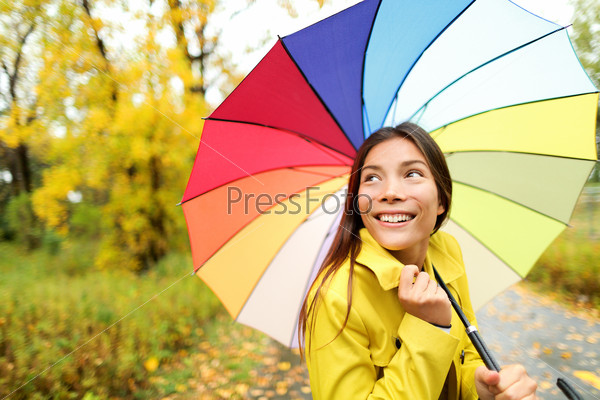 Autumn / fall - woman happy with umbrella in rain