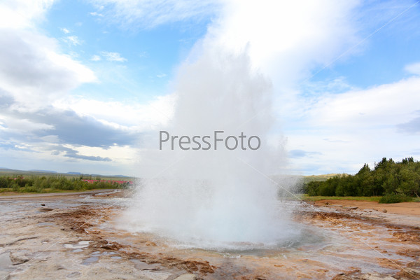 Iceland - Strokkur geyser. The famous Icelandic tourist attraction and landmark on the Golden Circle.
