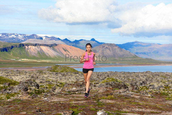 Runner woman trail running in nature