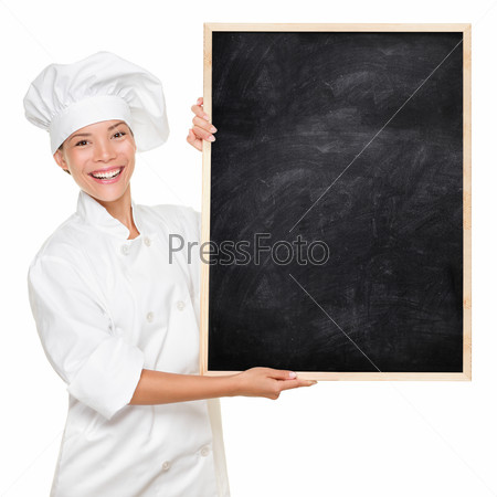 Chef. Woman cook showing empty menu chalkboard with copy space. Happy smiling Asian Caucasian female chef isolated on white background holding nice textured blackboard for advertising.