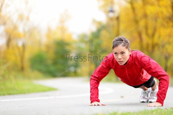 Crossfit woman doing push-ups