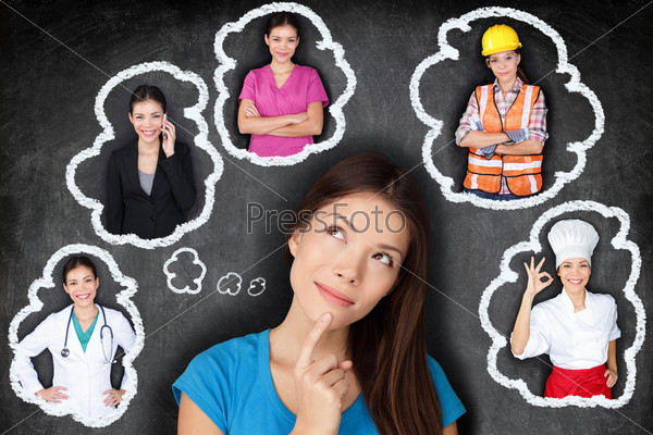 Education and career choice options - student thinking of future. Young Asian woman contemplating career options smiling looking up at thought bubbles on a blackboard with different professions