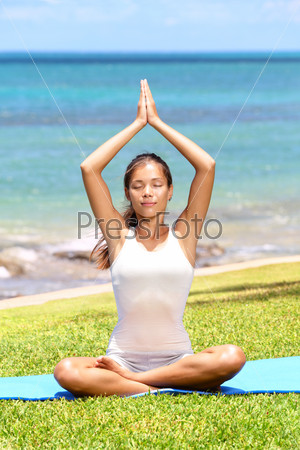 Yoga woman meditation by sea