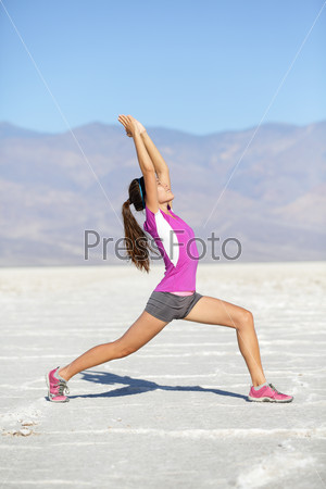 Fitness yoga woman stretching warrior one pose