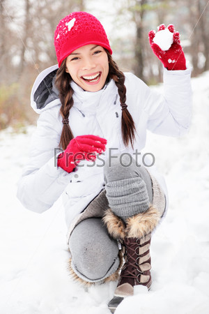 Winter woman playing in snow