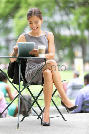 Businesswoman on break in park