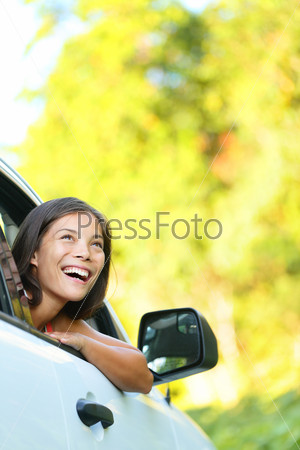 Car woman on road trip looking