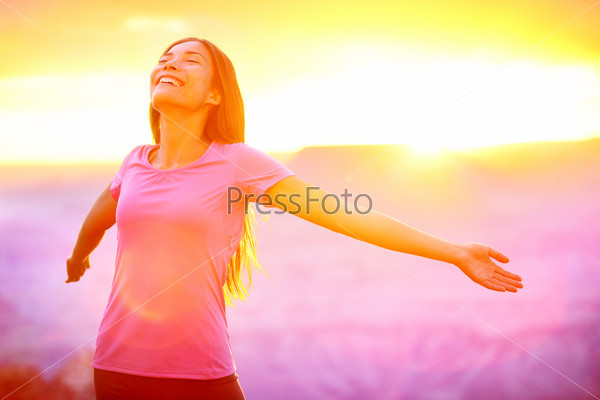 Happy People - Free Woman Enjoying Nature Sunset. Freedom And Serenity Concept With Female Model In Ecstatic Enjoyment. Mixed Race Asian Caucasian Female Model In 20 Enjoying Sunset, Grand Canyon, Usa