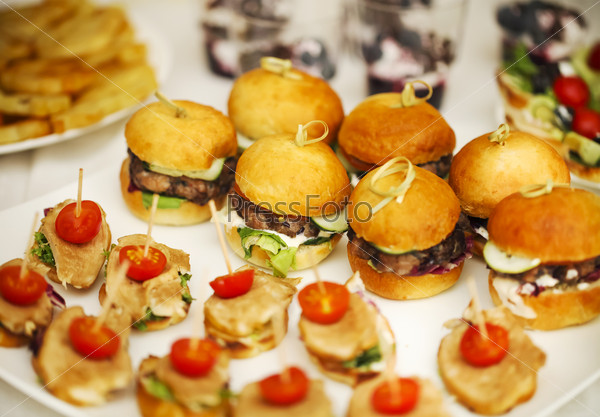 Variety of finger food on catering event. Shallow focus