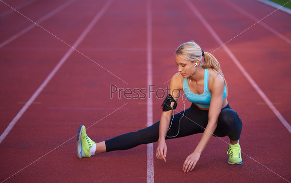 sporty woman on athletic race track