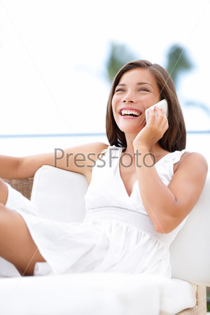 Phone woman talking on smartphone - on sofa