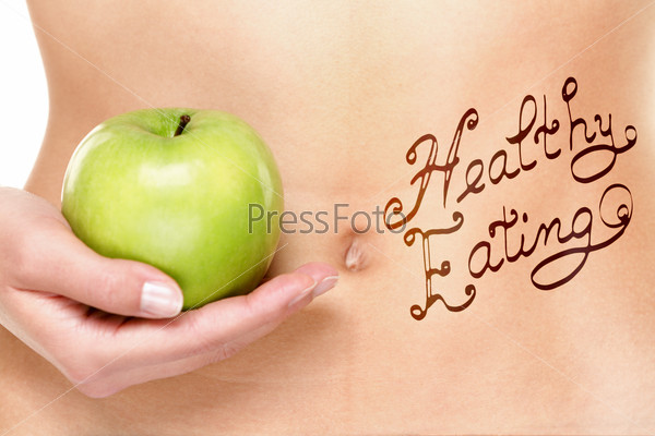 Healthy eating concept - woman stomach and apple