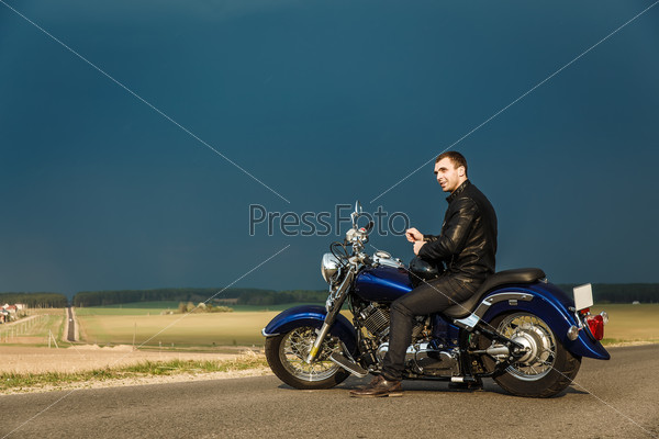 Man sitting on motorcycle