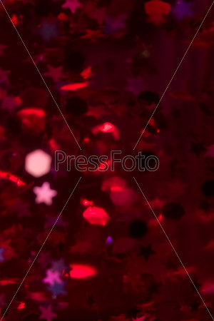 Pink lava lamp with bright stars in the dark, close up.