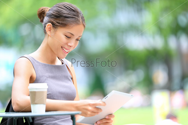Business woman using tablet on break