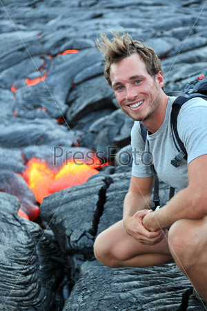 Hawaii: Hiker seeing lava from Kilauea volcano around Hawaii volcanoes national park, USA. Young caucasian man hiking.
