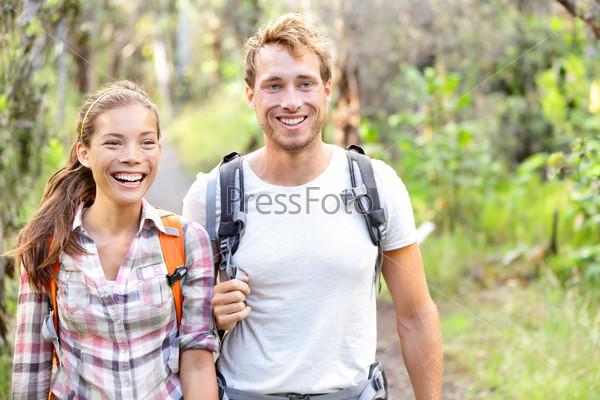 Hiking - hikers walking happy in forest