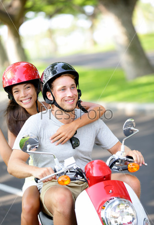 Free young couple on scooter on summer vacation
