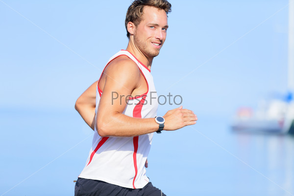 Running man runner looking at camera smiling