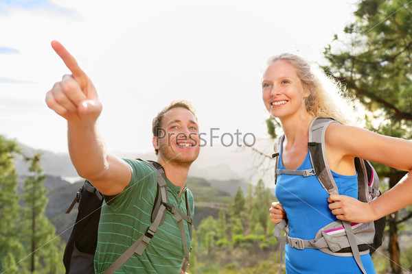 People hiking - couple on hike in forest