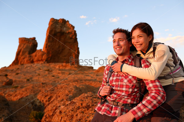 Happy couple active lifestyle hiking outdoors