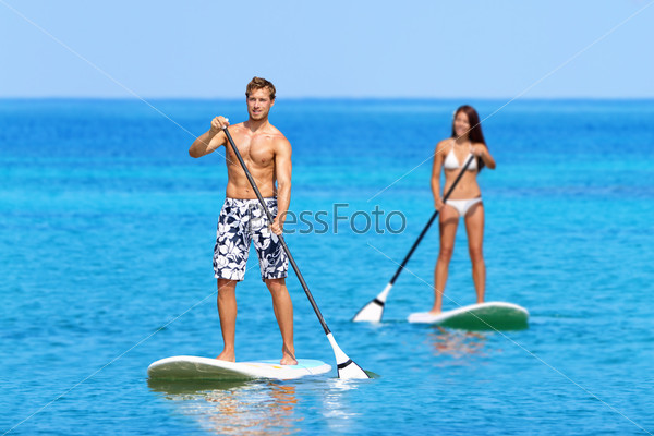 Paddleboard beach people on stand up paddle board